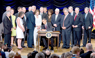 US President Barack Obama signs Dodd-Frank into law on 21 July 2010